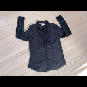 Woman’s black button down blouse
